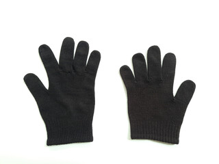 Obraz premium Two black fabric hand gloves isolated on white, overhead flat lay view 