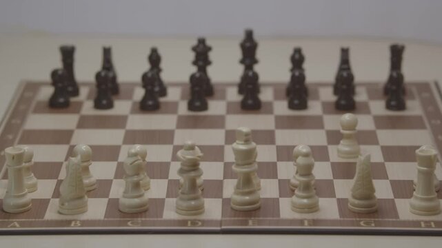 Cinematic close-up of the white pawn moving to g4, initiating the aggressive and unconventional Grob's Attack. Concept of bold strategy, surprise move, and creative chess tactics.