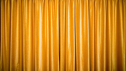 Warm golden velvet curtains abstract background