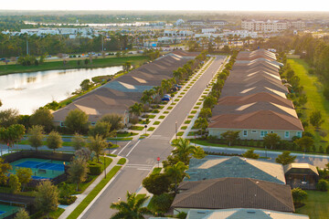 American gated community houses in rural US suburbs. View from above of large residential homes in small town in southwest Florida