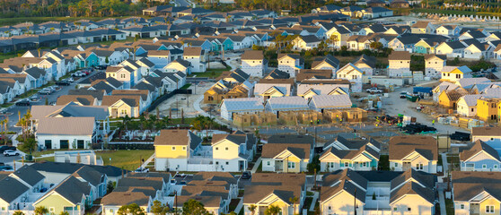 Development of residential housing in the USA. Wooden frames of new cheap American homes under construction