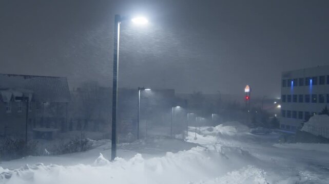 Atmospheric Night View Halifax Streets During A Heavy Winter Snowstorm.Thick Snowflakes Fall Rapidly While Streetlights Illuminate Snow Covered Roads Creating A Moody Urban Scene In Nova Scotia Canada