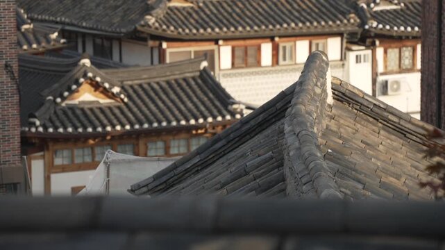 View of restored traditional houses in Bukchon Hanok Village at sunset, Jongno District, Seoul, South Korea