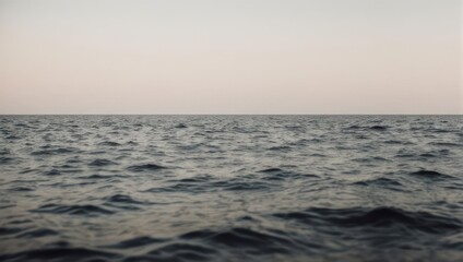 Fototapeta premium Calm Ocean Waters at Dusk - A Serene Seascape.