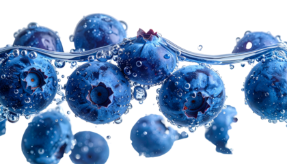 Close-up of vibrant blue berries submerged in crystal clear water, droplets clinging to their surfaces