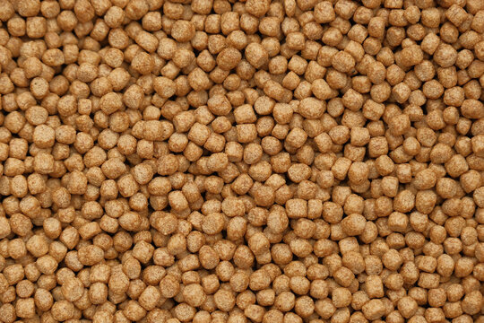 Close Up of Fish Feed Brown Pellets