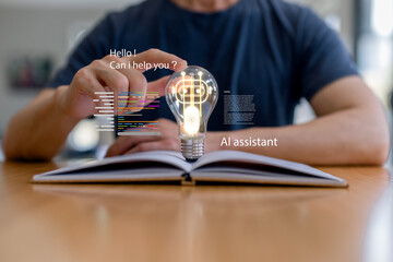 Man interacting with AI assistant concept, light bulb hologram and code interface above open book. Artificial intelligence learning, smart assistant, knowledge support, innovation, digital technology.