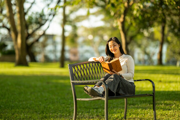 Young woman enjoying quiet reading time in park