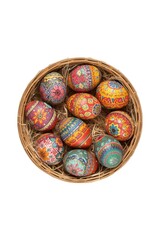 Colorful easter eggs in a woven basket
