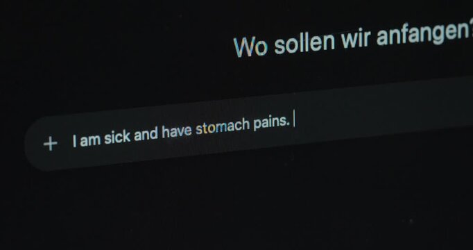 Close-up of a user typing symptoms into an AI interface to ask for a possible diagnosis. Concept of artificial intelligence in healthcare, digital health support, symptom checking, and modern medical