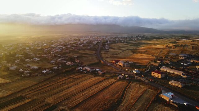 The village of Gamdzani at sunset, with Didi Abuli and the Abul-Samsari range in the background, part of the Lesser Caucasus. Samtskhe-Javakheti, Georgia