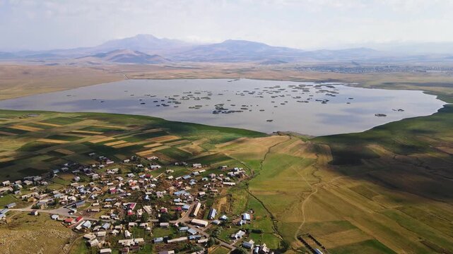 Khanchali Lake and village, with Didi Abuli and the Abul-Samsari range in the background, Khanchali Managed Reserve, Samtskhe-Javakheti, Georgia