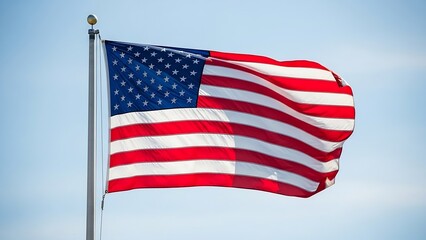 The American flag waves gently in the breeze against a clear blue sky.