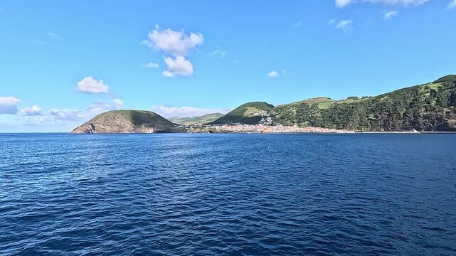 View of Horta, the harbor, shoreline, and surrounding volcanic landscape, Faial Island, Azores, Portugal