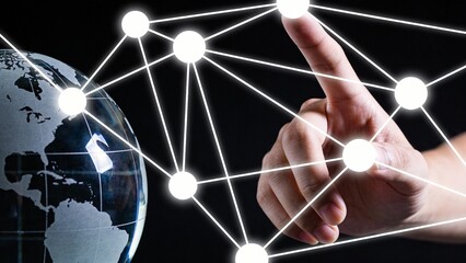 Hand connecting digital network to globe