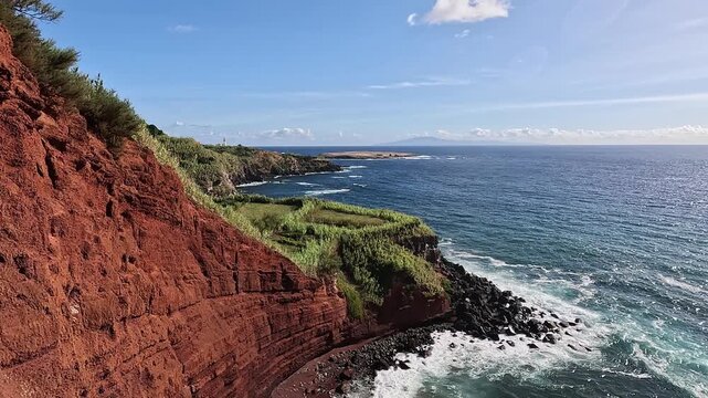 Praia de Argila do Topo, Red volcanic cliffs and rugged coastline near Topo on Sao Jorge Island, Azores, Portugal
