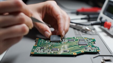 Electronics Repair - Precision Soldering and Component Placement on Circuit Board.