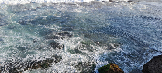 Waves crashing down on the beach	
