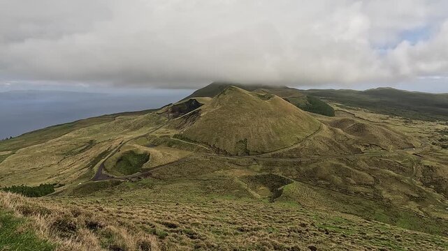 Low clouds above rounded volcanic cones on Pico Island, Azores, Portugal