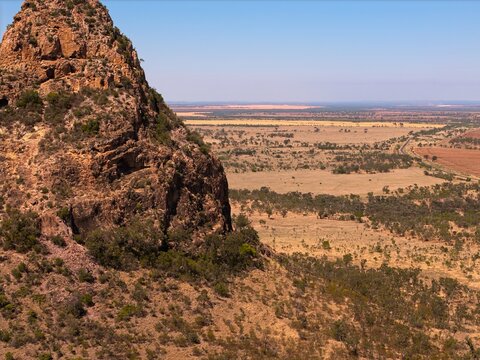 Drone aerial view of rugged mountain ranges in Outback Queensland, Australia - remote wilderness.
