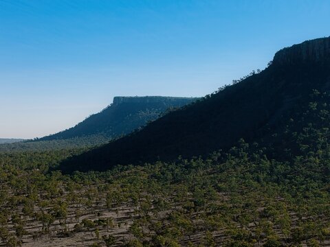 Drone aerial view of rugged mountain ranges in Outback Queensland, Australia - remote wilderness.