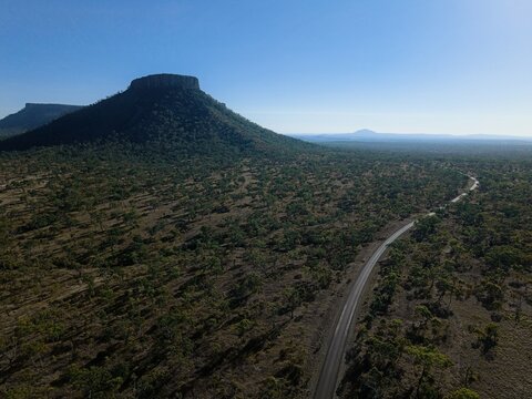Drone aerial view of rugged mountain ranges in Outback Queensland, Australia - remote wilderness.