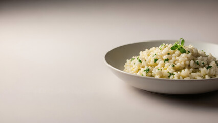 Minimalist food scene with cooked risotto, soft neutral background