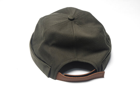 brimless docker hat or miki hat in a deep olive green or forest green earth tone. It features a structured, six-panel crown made from durable cotton twill fabric