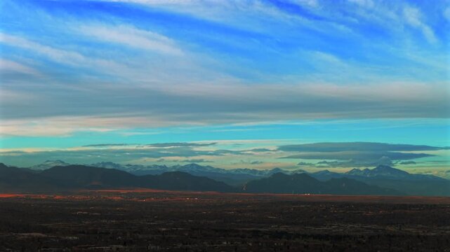 Front Range Rocky Mountains Denver winter landscape aerial drone landscape Boulder Flatirons Mountains sunset afternoon Wheatridge Arvada Broomfield Golden neighborhood suburbs circle left motion