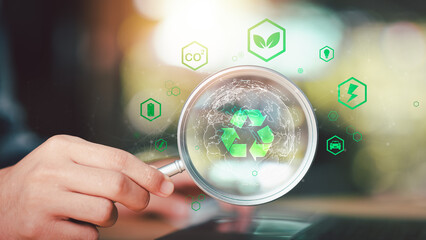 Environmental consultant reviewing ESG compliance and circular economy strategy using digital...