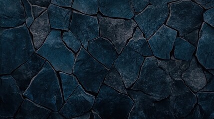 Fototapeta premium A textured background of jagged broken pieces of dark stone cemented together forming an abstract pattern