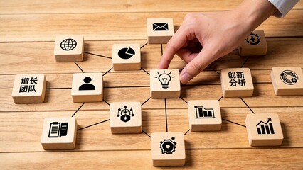 Hand arranging business strategy blocks