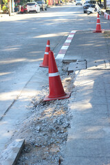 Traffic cones are placed at a construction site on the road.