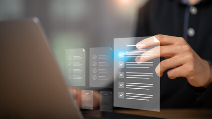 Hand using digital stylus to interact with virtual checklist on a screen, representing smart evaluation, online documentation, and workflow management in a digital workspace.
