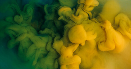 Ink splash. Mist yellow art. Defocused green blue color dust texture natural cloud acrylic splash spreading on abstract background.