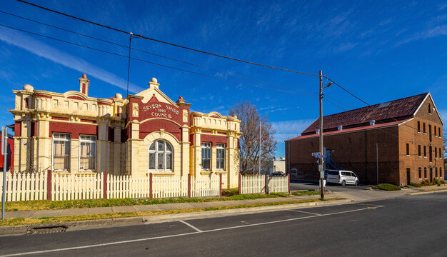 The old art deco Severn Shire Council Offices built in Glen Innes in 1910, old mill behind