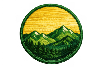Embroidered circular patch displaying mountain range and pine forest landscape at sunrise, transparent background