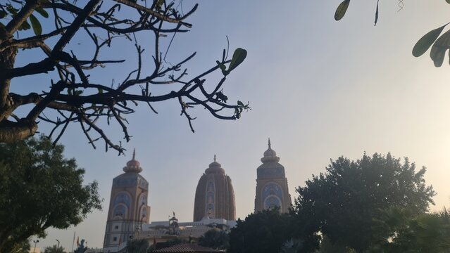 The Grand Shikharas of the Historic Agroha Dham Temple Seen Through Tree Branches in Hisar Haryana India