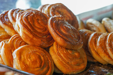Pile of Golden Brown Sweet Buns with Glaze