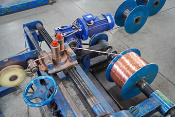 Coils with copper wire. Optical fiber production workshop.