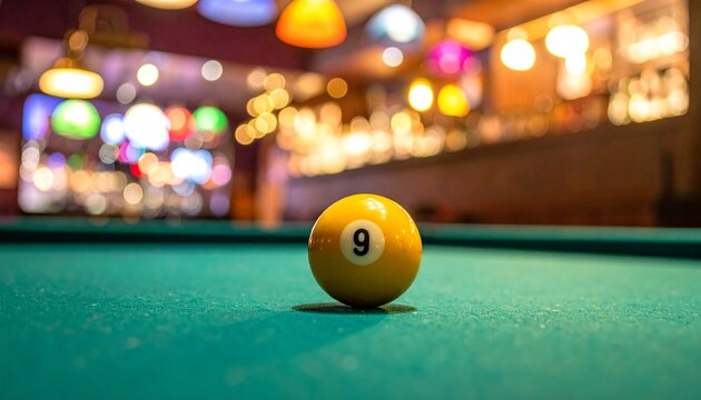 Yellow 9-ball on pool table with bokeh bar lights