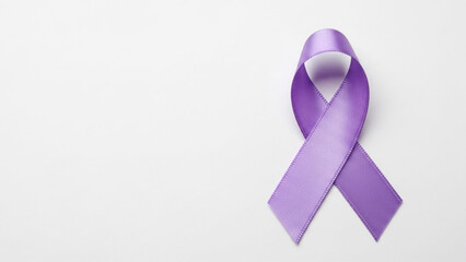 Purple awareness ribbon symbol representing support and solidarity for various causes isolated on a clean white background
