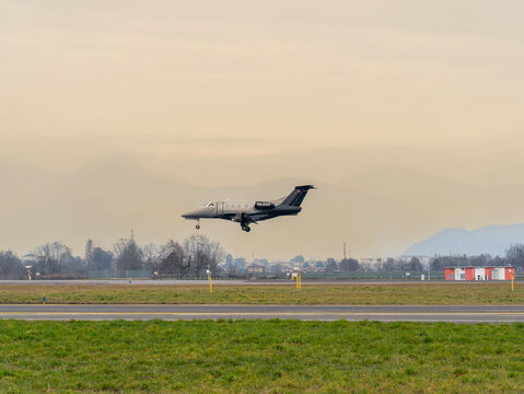 Embraer Phenom 100 private owner airplane lands at BGY Milano Bergamo airport