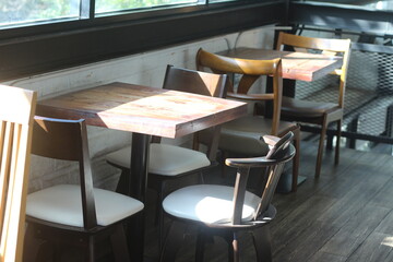 Wooden tables and chairs at the cafe.