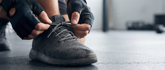 Athlete Tying Sports Shoe Laces Before Workout Training