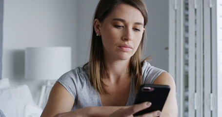 Woman, phone and sad in bedroom with texting, notification and online dating chat at apartment....