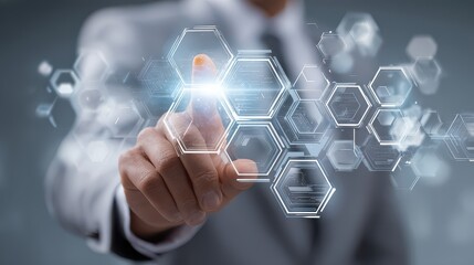 Touching a digital interface with hexagon shapes in a technology setting during a business meeting