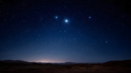 Fototapeta premium A brilliant starry night sky illuminates a vast dark desert landscape under the celestial glow