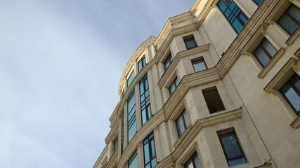 Classic European style apartment building facade with curved architecture