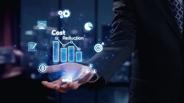 A businessman stands in a modern office, showcasing a digital interface that illustrates cost reduction strategies, featuring graphs, icons, and finance symbols. Qubit